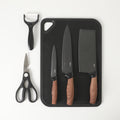 Oster Gunderson 6pc Stainless Steel Cutlery Set w/ Black Cutting Board - Black Textured Nonstick Blade - ABS Bolster/PP Wood Look Handle - Clam Pack